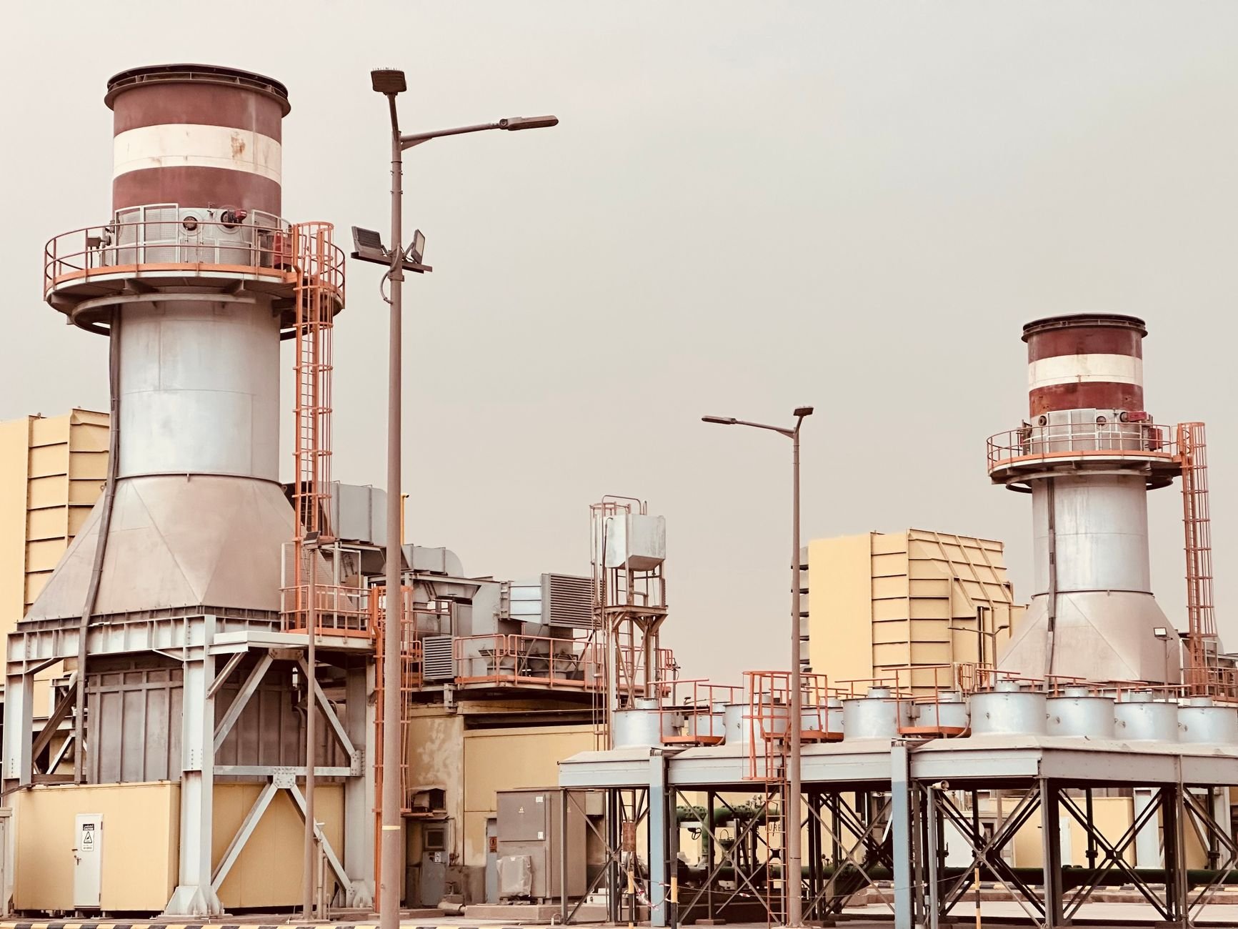 Industrial power plant towers — the kind of facility CYPAK supports with generator and diesel system maintenance